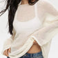 Cream-colored boat neck dropped shoulder knit sweater with sheer mesh chest panel