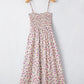 Off-white bohemian ditsy floral smocked fit flare sundress on hanger