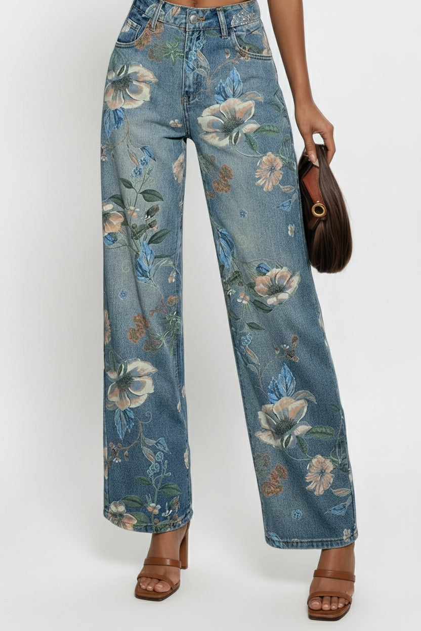 Floral-patterned jeans worn by a person on a white background