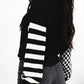 Black knit turtleneck sweater with white striped sleeves and dropped shoulders