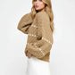 Cozy camel cable-knit sweater with cream diamond pattern and puff sleeves