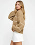 Cozy camel cable-knit sweater with cream diamond pattern and puff sleeves