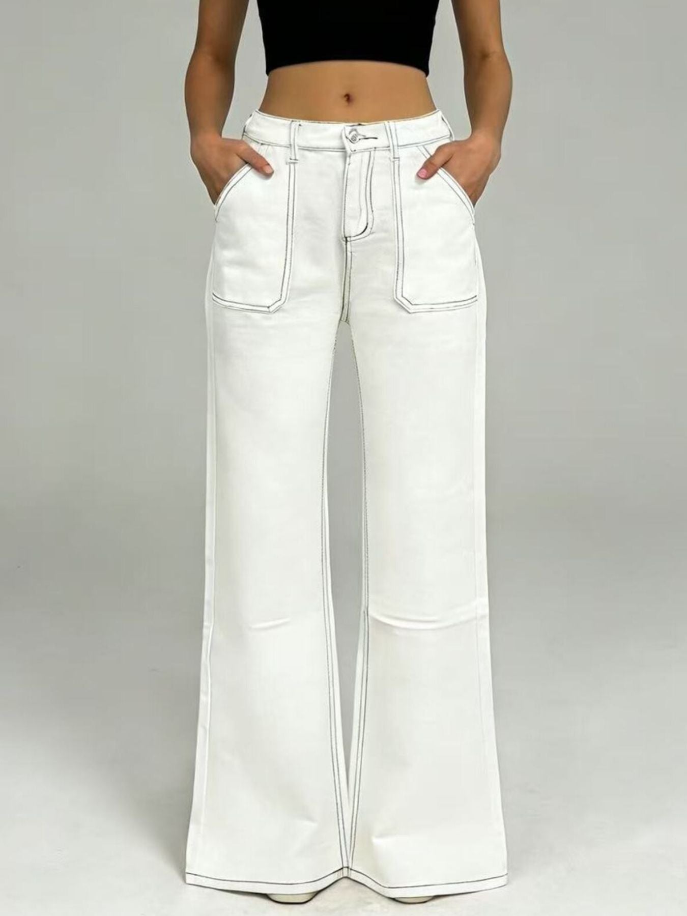 White wide-leg denim pants with black contrast stitching, high-rise waist