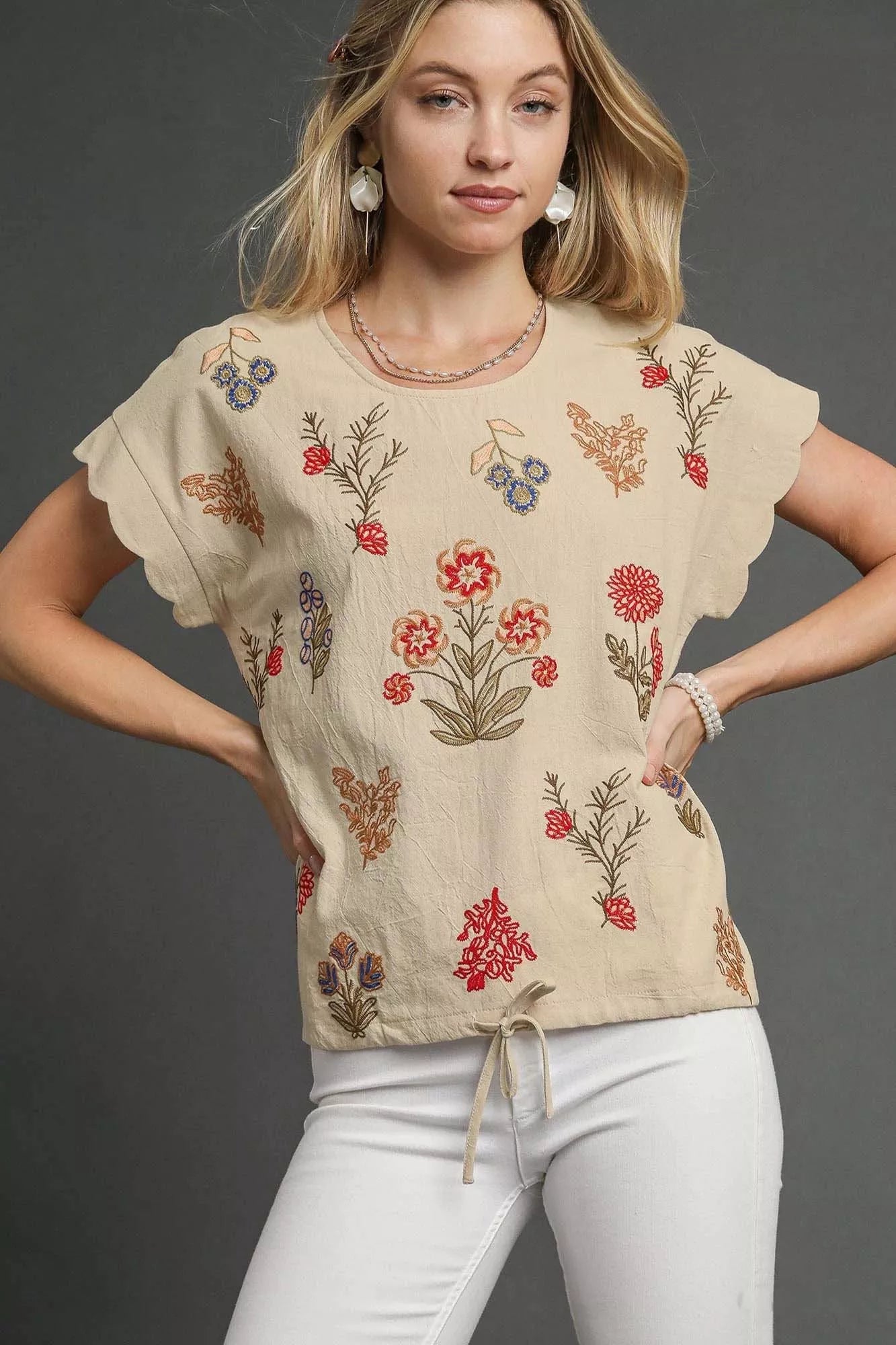 Beige Umgee embroidered floral top with scallop flutter sleeves and drawstring hem