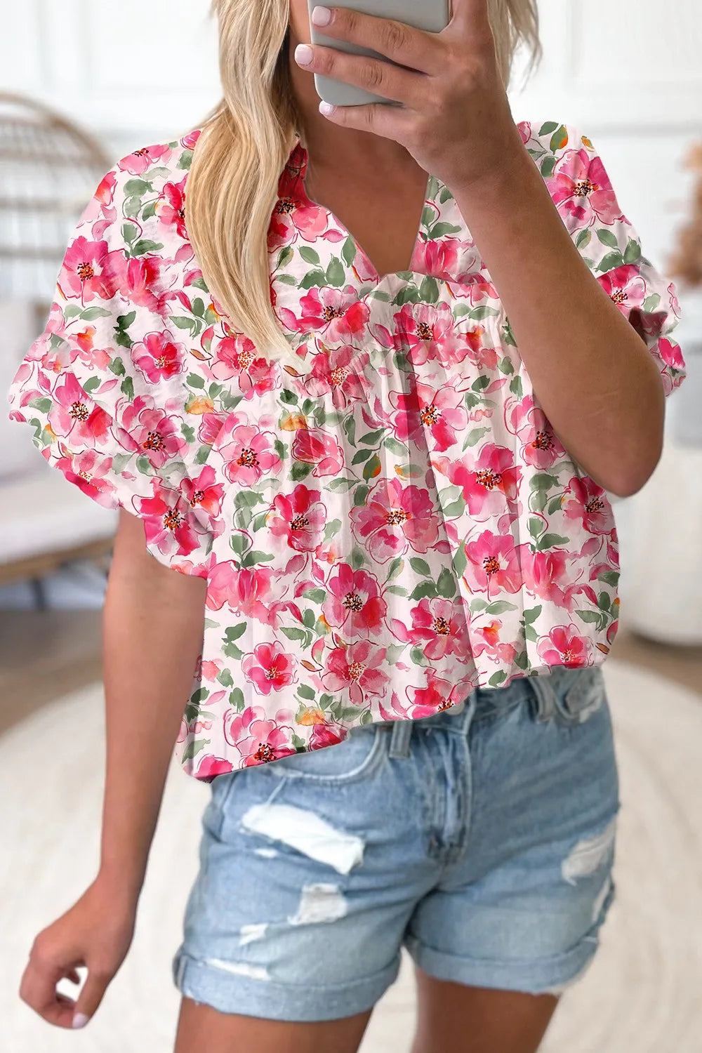 Pink floral boxy fit ruffled short sleeve blouse with v-neckline