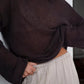 Boat neck dropped shoulder sweater in loose dark brown knit with sheer texture