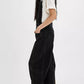 Black wide-leg denim overalls with wide straps, relaxed fit and visible stitching