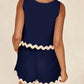 Daverri Fashions navy blue sleeveless top and shorts set with cream scalloped trim