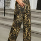 Leopard print wide-leg pants with high waist and pockets.