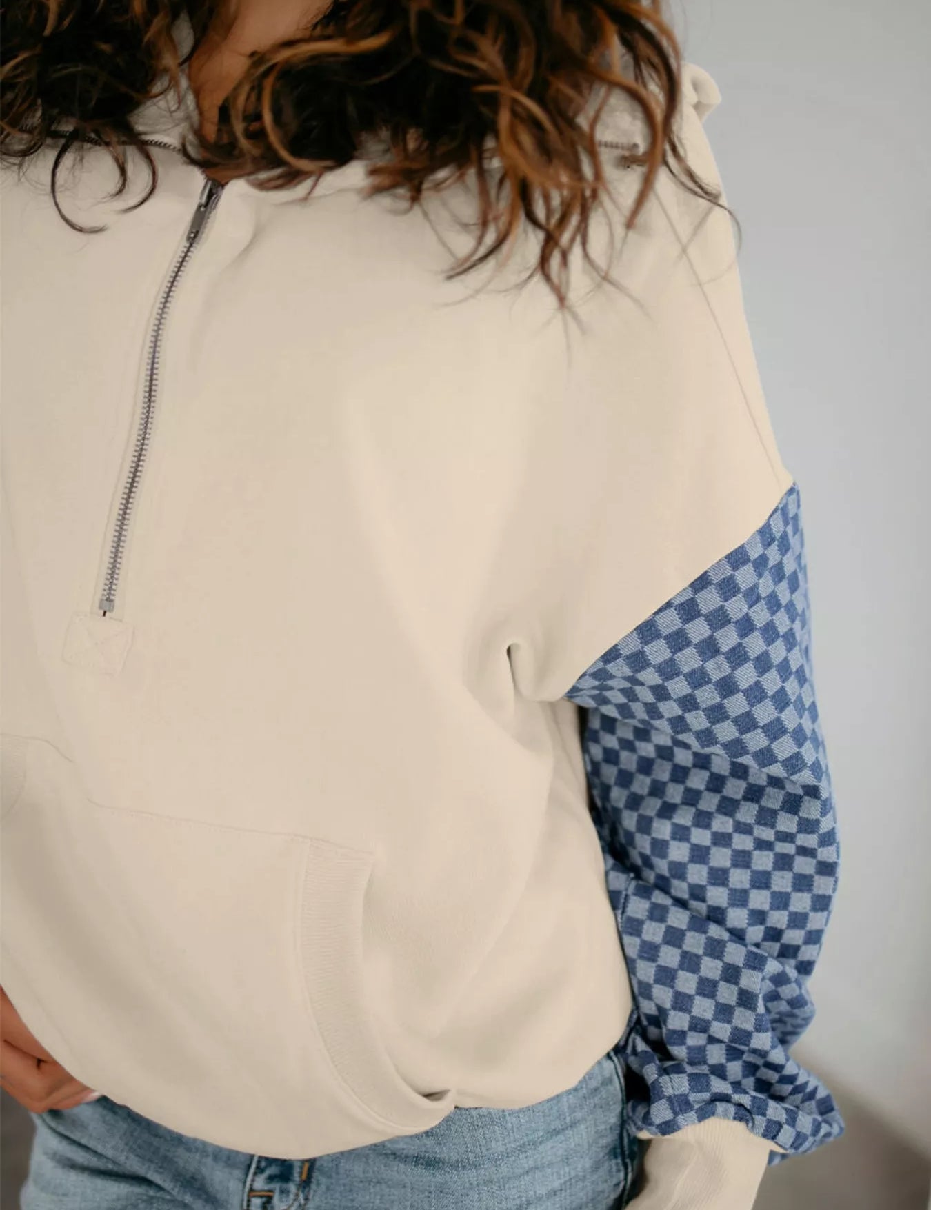 Cream and blue checkered half-zip long sleeve sweatshirt