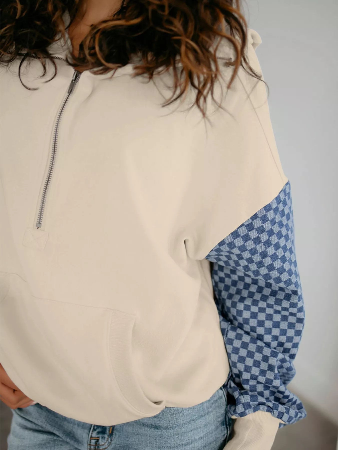 Cream and blue checkered half-zip long sleeve sweatshirt
