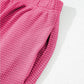 Pink waffle-knit pants in textured ribbed fabric with elastic waistband from Solid Color Textured Buttoned Shirt and Casual Pants Set