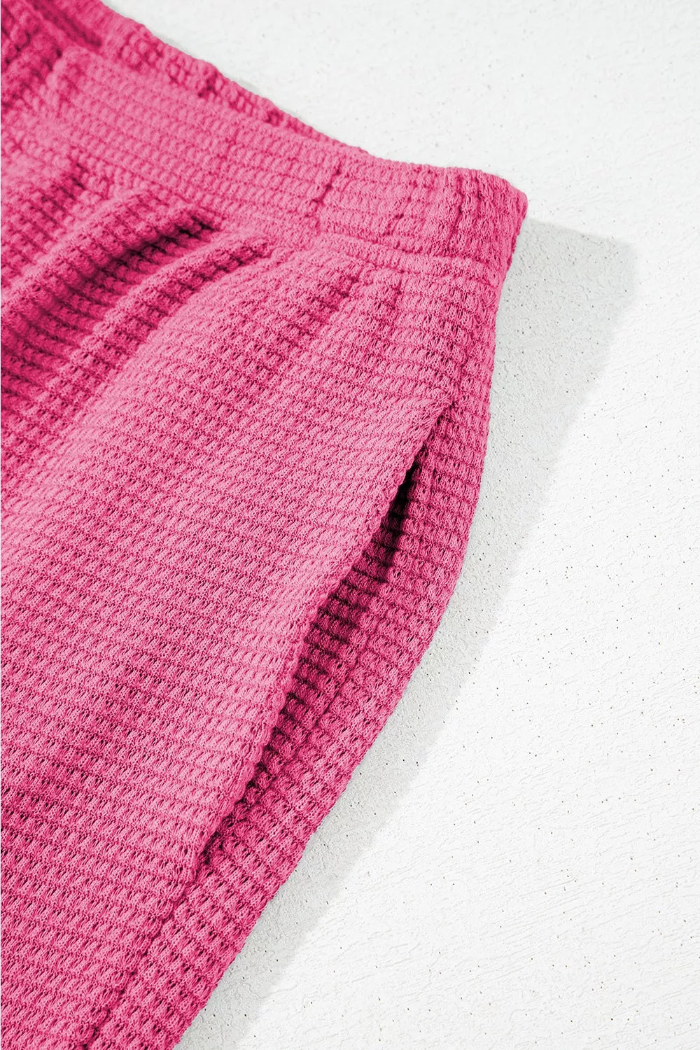 Pink waffle-knit pants in textured ribbed fabric with elastic waistband from Solid Color Textured Buttoned Shirt and Casual Pants Set