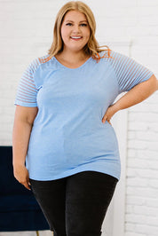 Plus size light blue striped V-neck raglan tee with black leggings