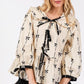 SAGE + FIG Bow Print Tie Front Babydoll Blouse - DAVERRI FASHIONS