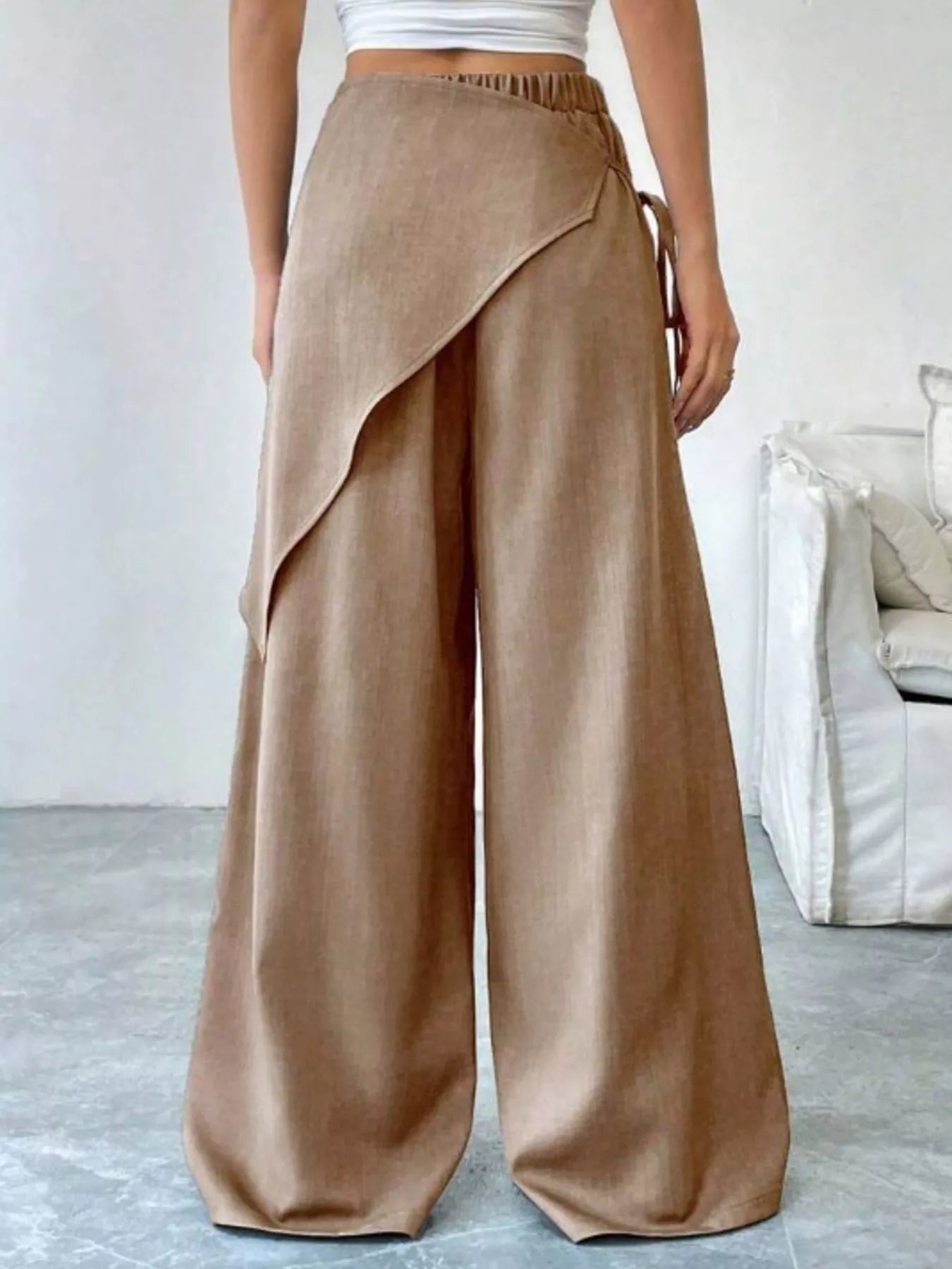 Daverri wrap-front wide-leg pants in tan with draped asymmetrical design
