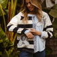 Woman in BiBi Patchwork Striped Round Neck Sweatshirt with blue patches