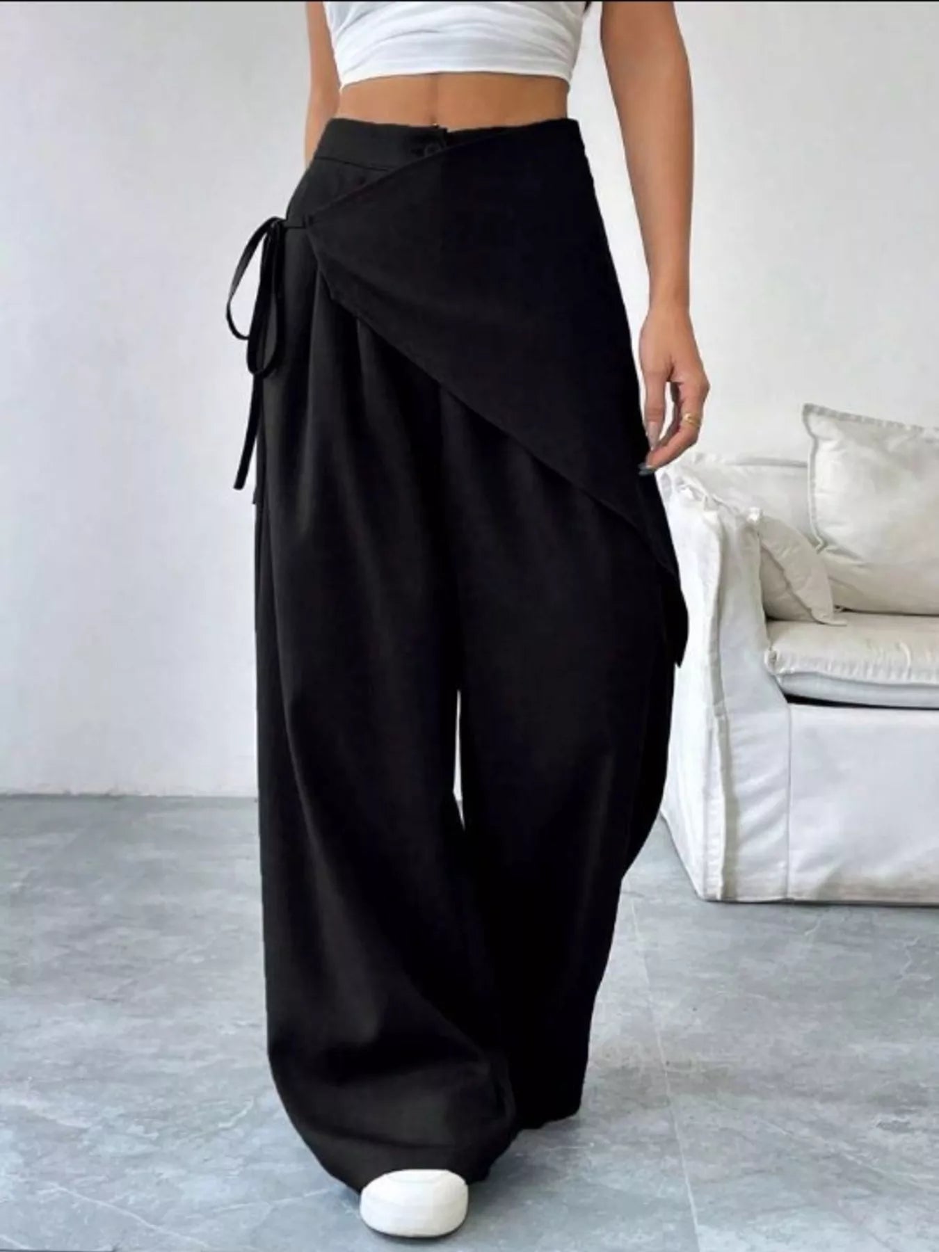 Daverri Wrap-Front Wide-Leg Pants in black with draped asymmetrical design and side tie detail