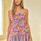 Davi & Dani floral smocked sleeveless ruffle back tie top in vibrant multicolored print