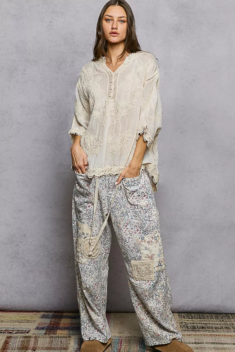 Model in POL Floral Embroidered Top with lace trim cuffs and hem