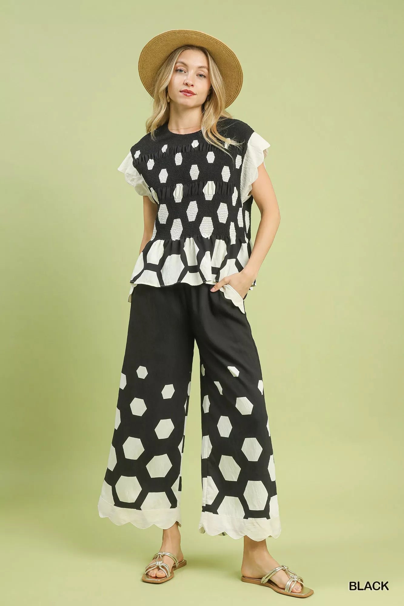 Black and white hexagonal peplum top with ruffled sleeves