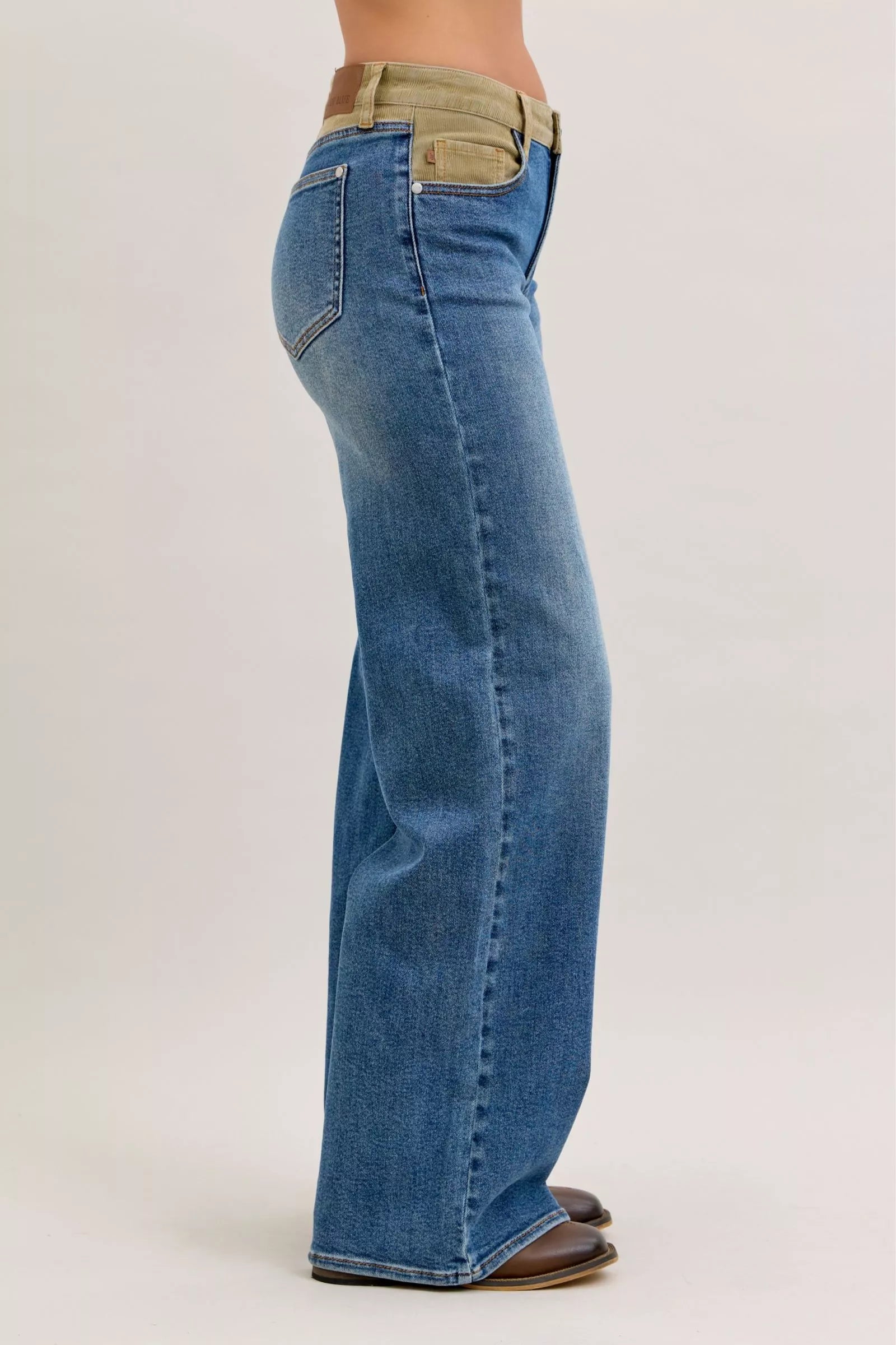 Back view of Judy Blue mid-rise jeans with tan corduroy waistband