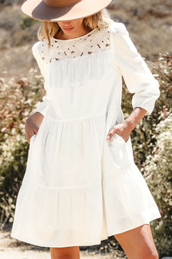White 3/4 sleeve tiered mini dress with lace neckline detailing
