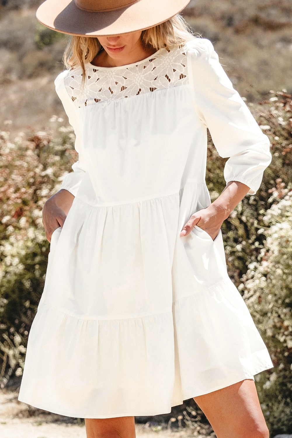 White 3/4 sleeve tiered mini dress with lace neckline detailing