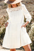 White 3/4 sleeve tiered mini dress with lace neckline detailing