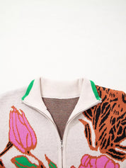 Floral knit quarter zip sweater with green accents and tiger stripes