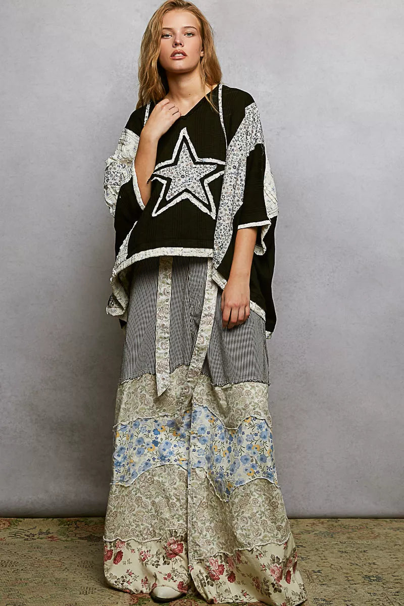 Black and white star-patterned patchwork hooded blouse with floral lace details