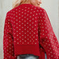 Red cropped knit Daverri sweater with white butterfly motifs