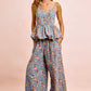 BiBi light blue floral jumpsuit with peplum waist and yellow tie straps