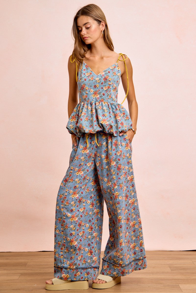 BiBi light blue floral jumpsuit with peplum waist and yellow tie straps