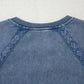 Blue denim sweatshirt with lace trim on raglan sleeves