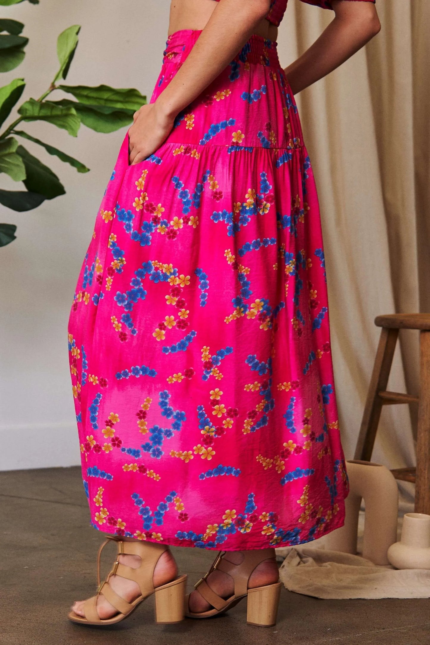 Vibrant pink Davi & Dani printed smocking waistband ruffled maxi skirt with floral pattern