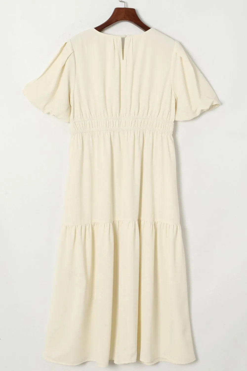 Cream-colored puff sleeve pleated high waist flowy midi dress with ruffles and V-neck