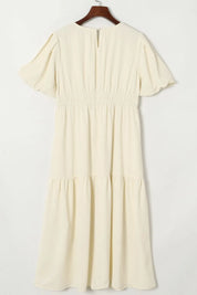 Cream-colored puff sleeve pleated high waist flowy midi dress with ruffles and V-neck