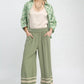 Sage green Umgee wide-leg pants with lace fringe hem trim