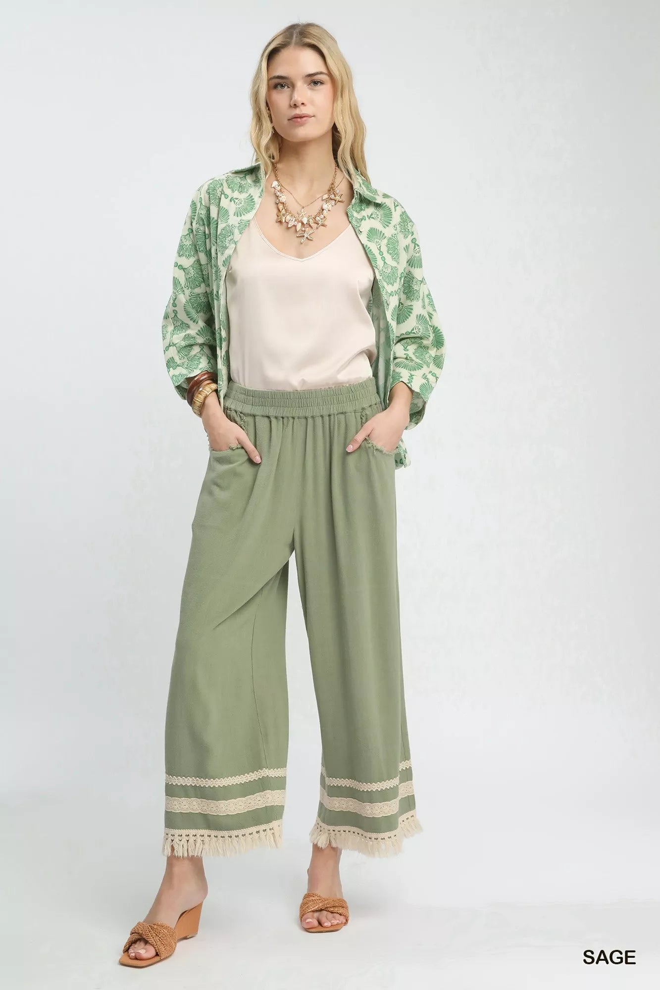 Sage green Umgee wide-leg pants with lace fringe hem trim
