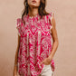 BiBi Printed Pink Ruffle Sleeve Top with vibrant pink fabric, white intricate pattern, and frayed hem