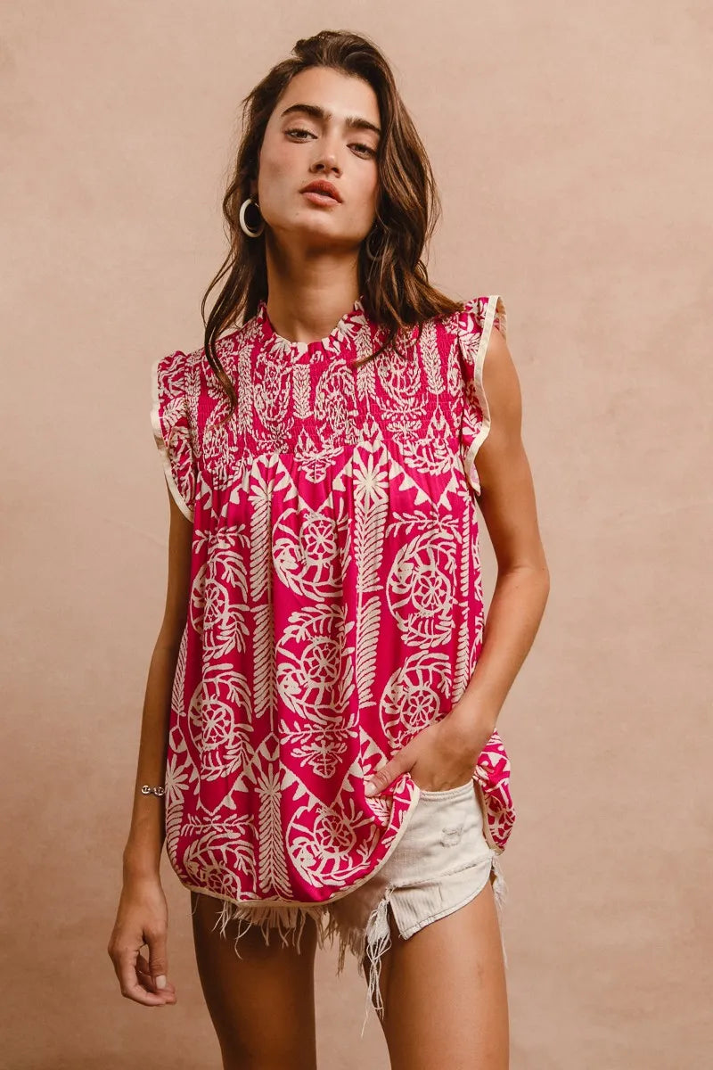 BiBi Printed Pink Ruffle Sleeve Top with vibrant pink fabric, white intricate pattern, and frayed hem
