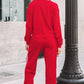Women’s red crewneck sweatshirt and sweatpants set with white side stripes