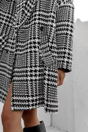 Black and white houndstooth collared long sleeve coat with pockets