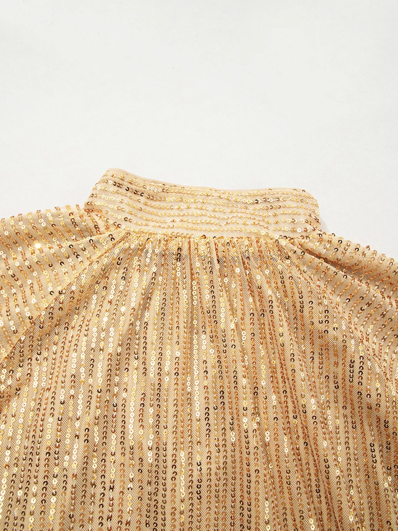 Gold sequined turtleneck blouse with balloon sleeves