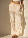 Soft pastel-patterned lounge pants in cream and pale pink with drawstring waistband