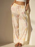 Soft pastel-patterned lounge pants in cream and pale pink with drawstring waistband