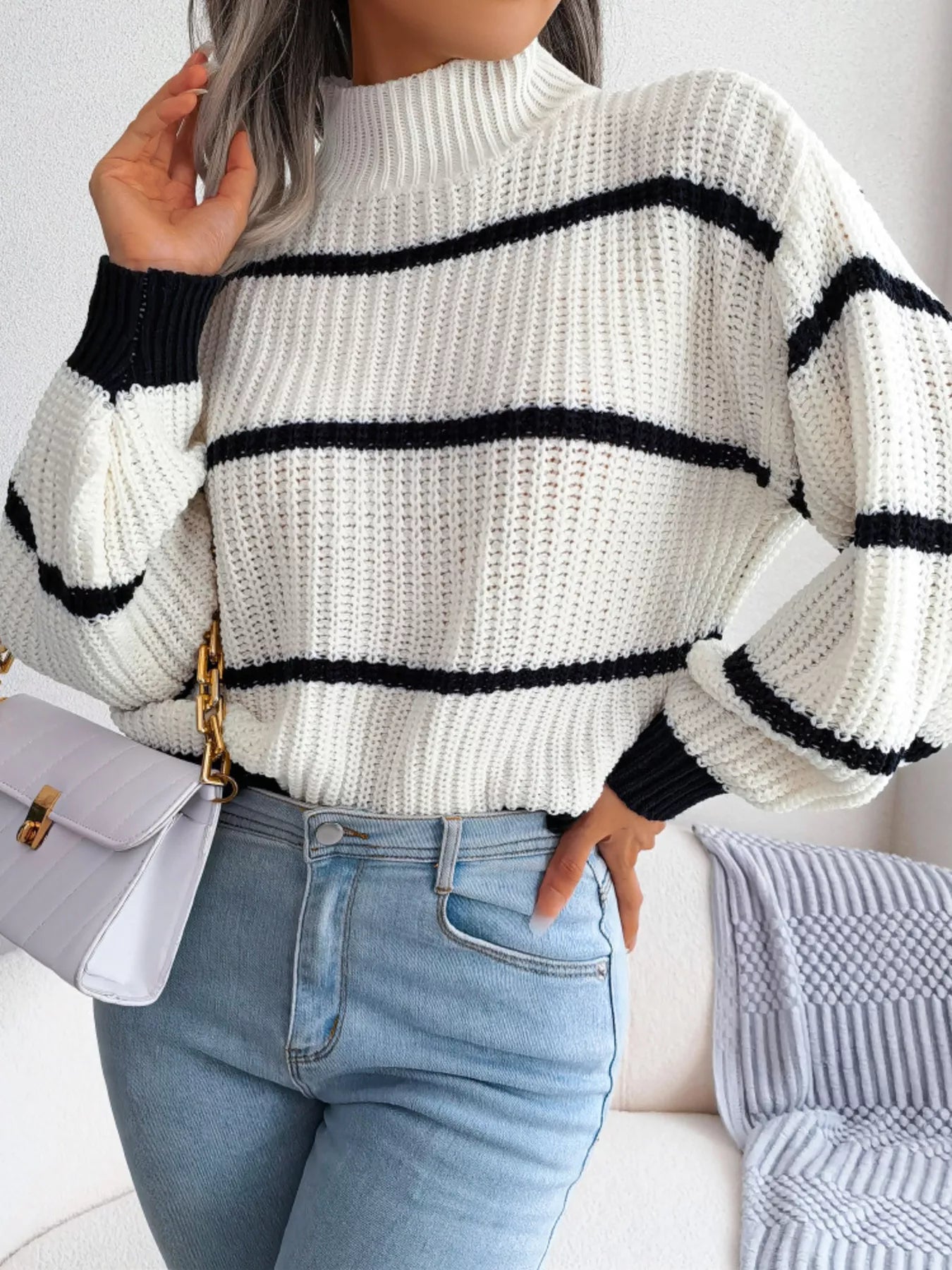 White and black striped ribbed knit sweater with high turtleneck