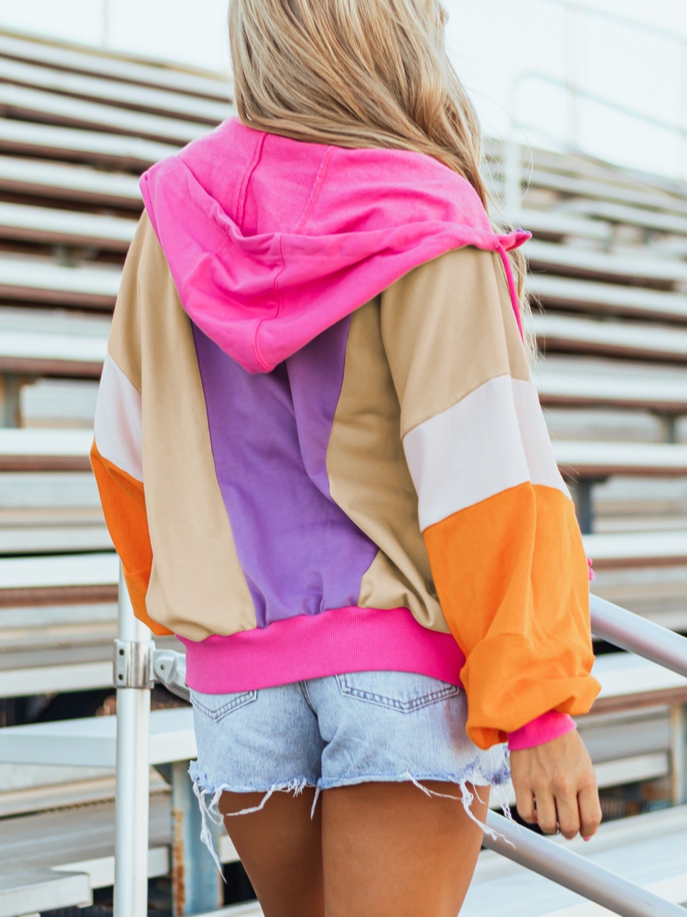 Color block zip-up hoodie with pink hood, beige, purple, orange panels