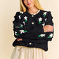 Black cropped Davi & Dani cardigan with puff sleeves and daisy embroidery